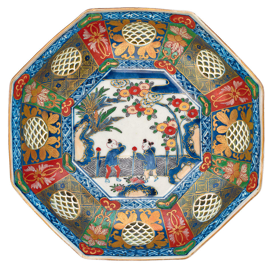 Dish with two Chinese boys in a garden