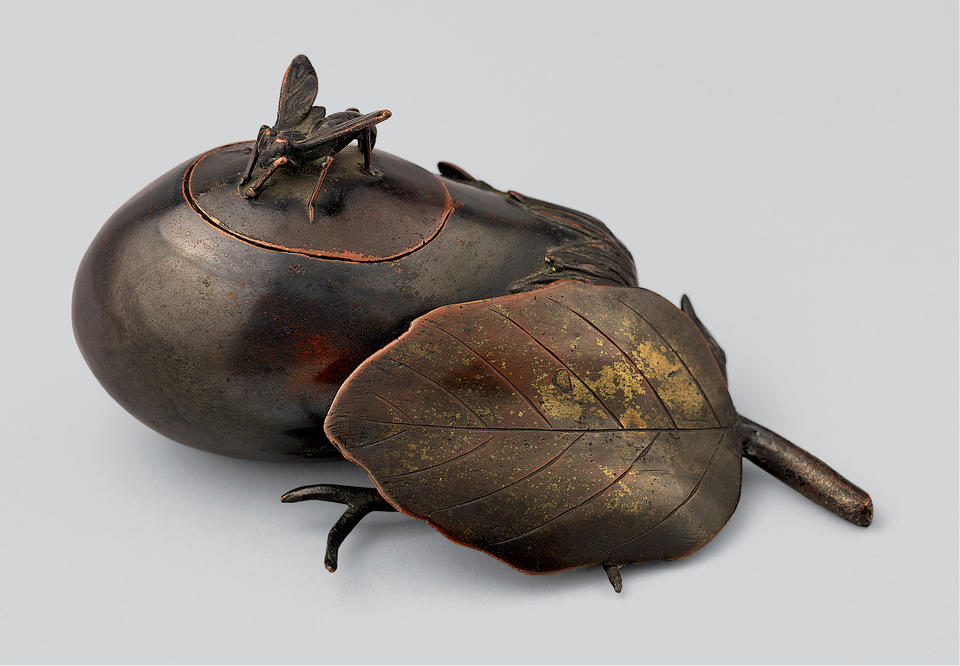 Incense burner in the shape of an eggplant with an insect