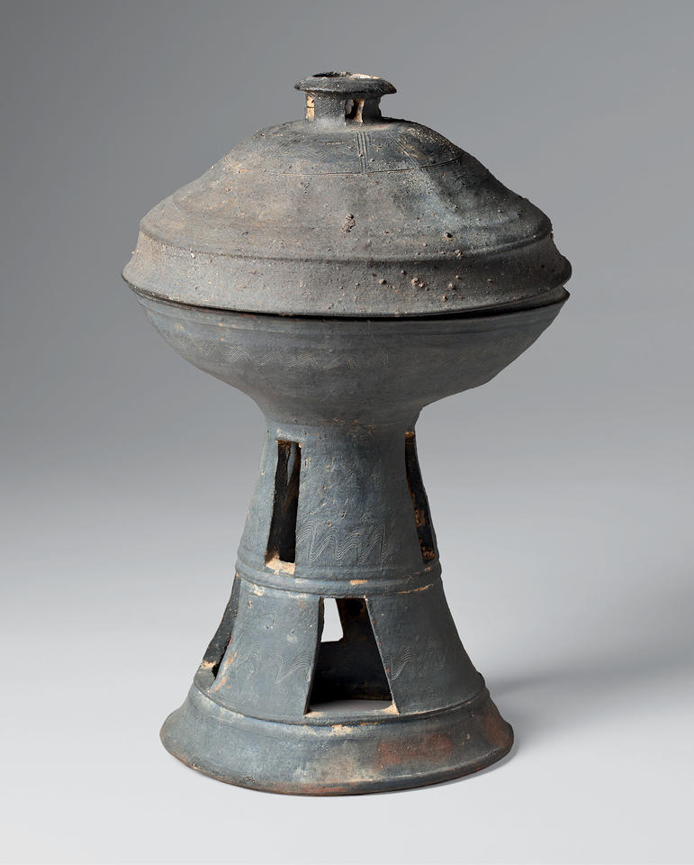 Lidded dish with tall, perforated base