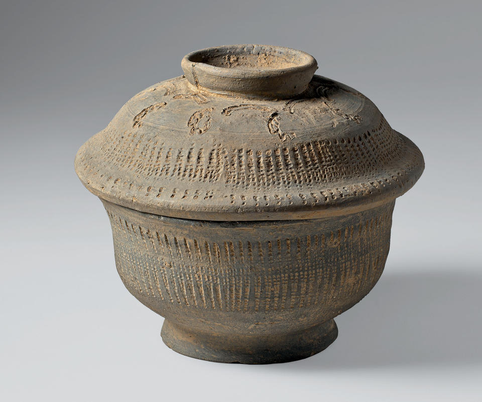 Covered bowl with abstract and geometric pattern