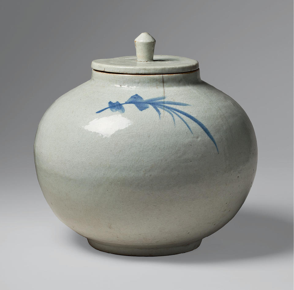 Lidded jar with sprig