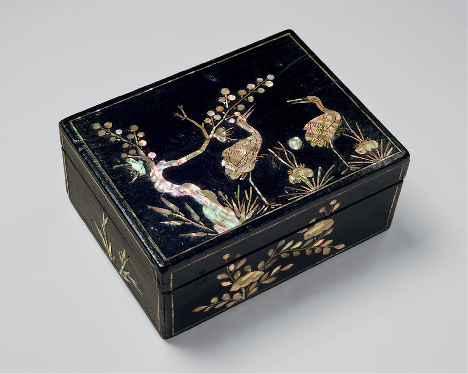 Box with cranes and plum tree